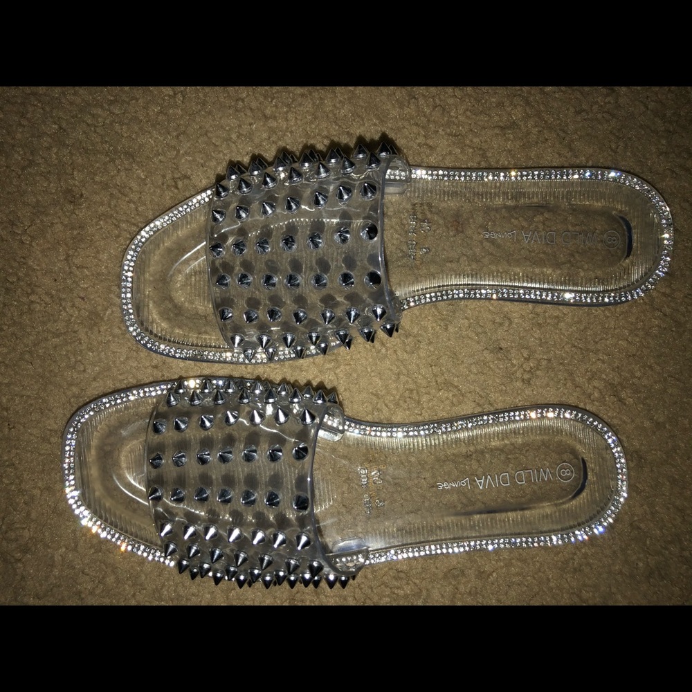 Clear flat sandal with spikes!